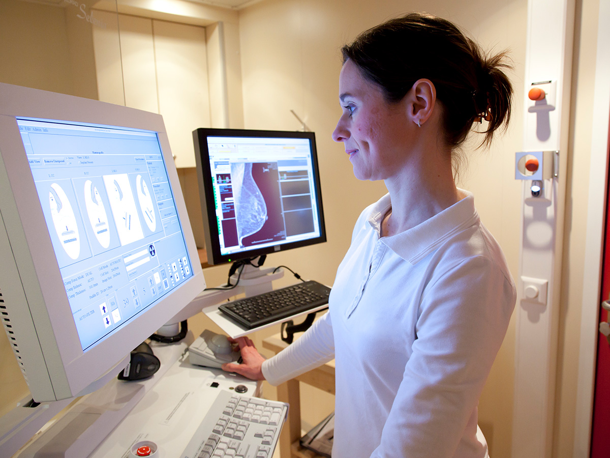 A radiologist looking at a scan.