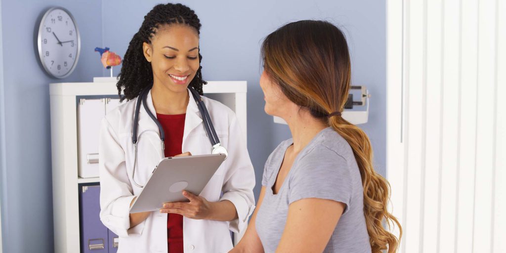 Female doctor speaking with patient