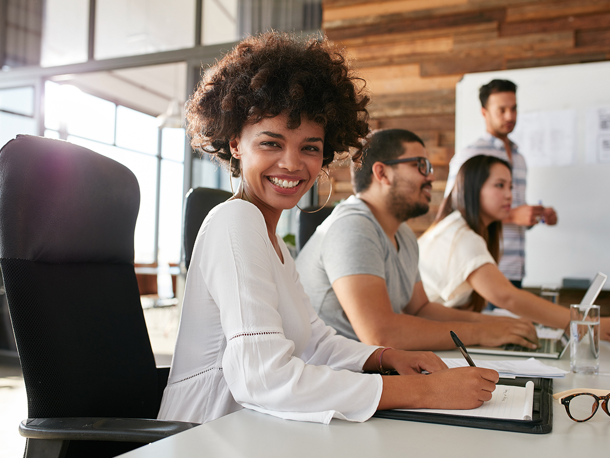 happy woman at a business meeting desk