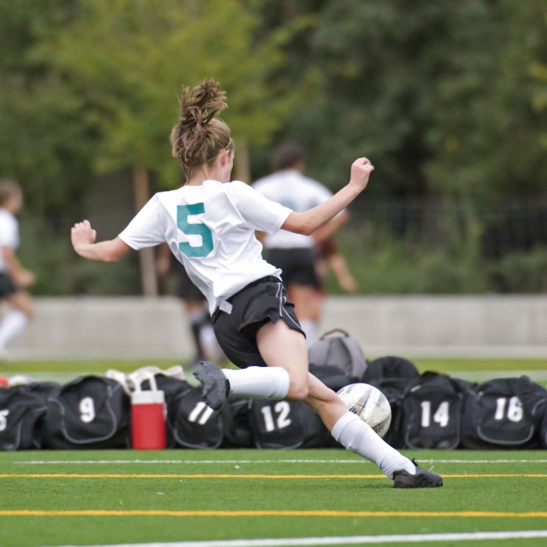 teen playing soccer