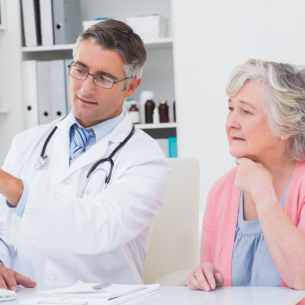 doctor and patient looking at computer