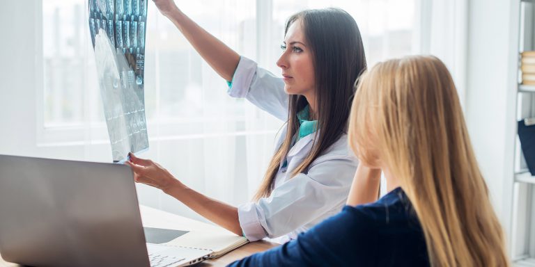 female doctor looking at imaging