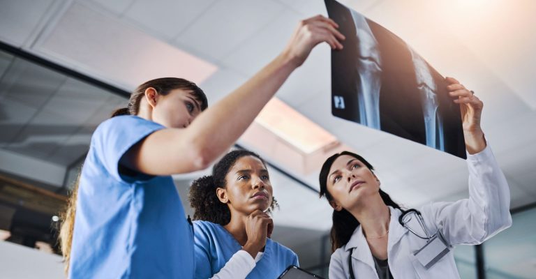 Medical personnel checking x-rays.