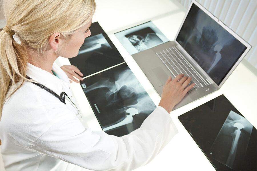 medical professional examining xrays